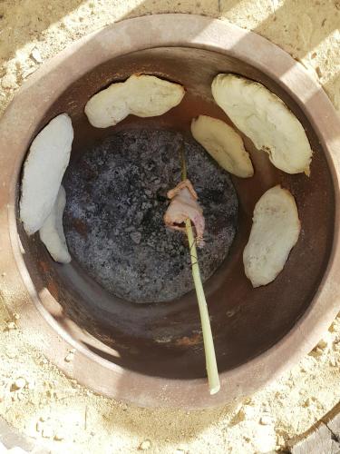 a bowl of food with two bamboo sticks in it at Lomtadze Family Wine Hotel in Ambrolauri