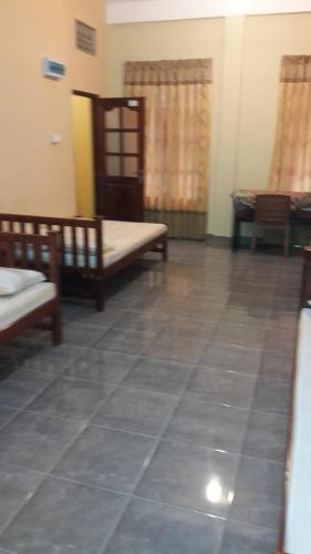 Postel nebo postele na pokoji v ubytování Anura Guest Inn