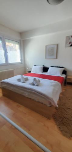 a bedroom with a large bed in a room at Aleks 4 in Skopje
