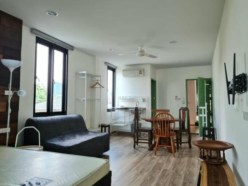 a living room with a couch and a table at Lee Home Bangkok in Bangkok