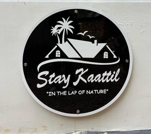a sign that says stay katilli in the lap of nature at Stay Kattil Varkala in Varkala