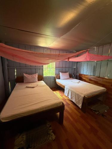 a room with two beds in a tent at Sweet View Guesthouse in Koh Rong
