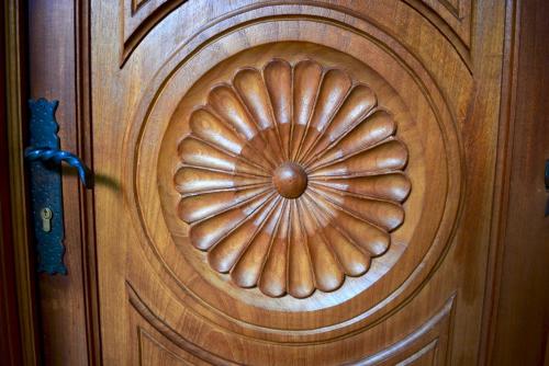 a wooden door with a circular design on it at Hotel Candelaria Antigua in Antigua Guatemala