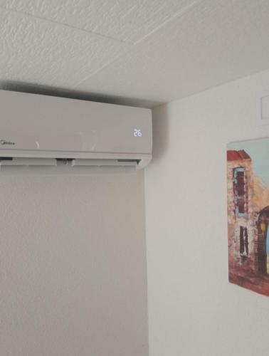 a television hanging on a wall in a room at Studio Biokovo smaller object 22 m2 in Makarska