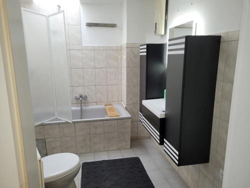 a small bathroom with a toilet and a sink at FeWo Landkirchen 2 in Fehmarn