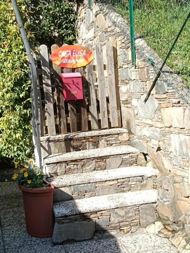 a set of stone stairs with a sign on it at CASA ELISA in Cavaglio San Donnino