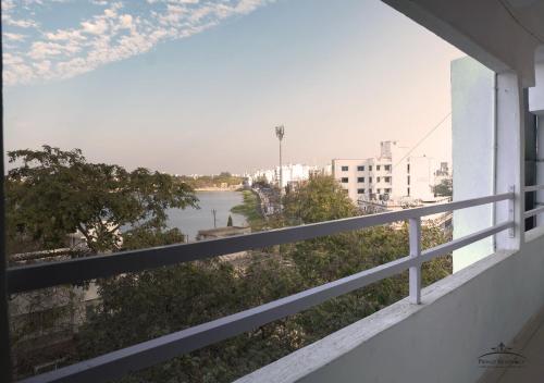 a view of a river from a balcony at Prince Residency in Jamnagar