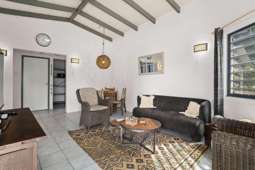 a living room with a couch and a table at 19 Casa Peces in Kralendijk