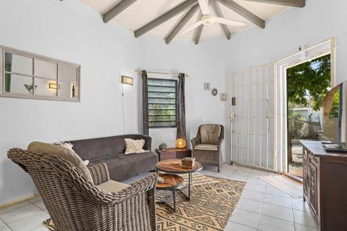 a living room with a couch and a table at 19 Casa Peces in Kralendijk