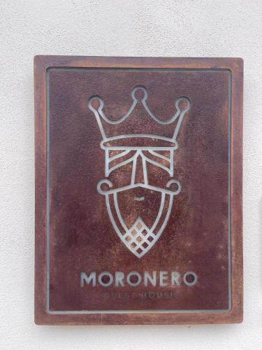 a brown sign with a monmorro on it at Moronero in Ragusa