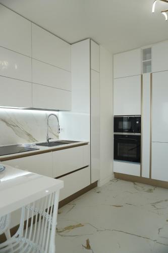 Kuchyň nebo kuchyňský kout v ubytování FronteMare Apartment