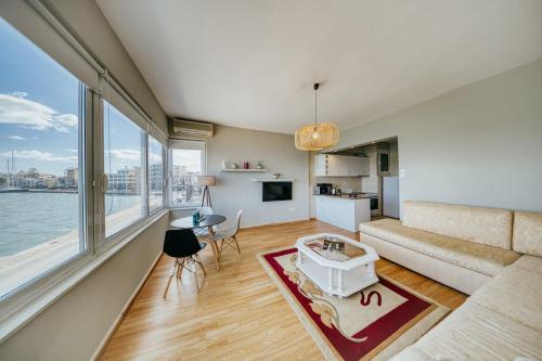 a living room with a couch and a table at Faros in Chios