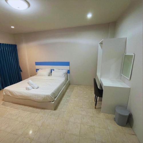 a hotel room with a bed and a desk at Elements Residence Samui in Koh Samui 