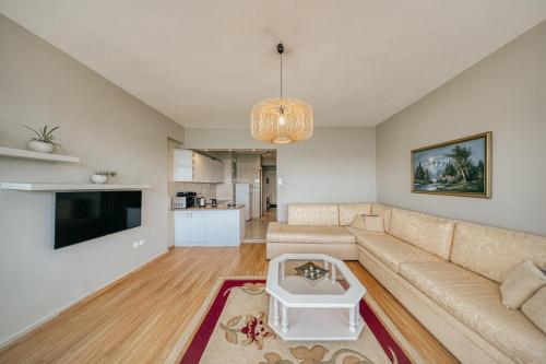 a living room with a couch and a tv at Faros in Chios