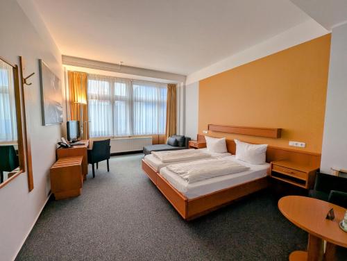 Postel nebo postele na pokoji v ubytování DLRG Tagungszentrum Hotel Delphin