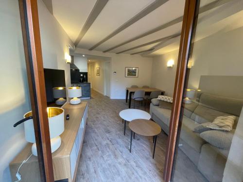 a living room with a couch and a table at Villmor - B23 - Corazón del Casco in Benasque