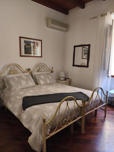 a bedroom with a bed with a metal frame at B&B Federica in Cagliari
