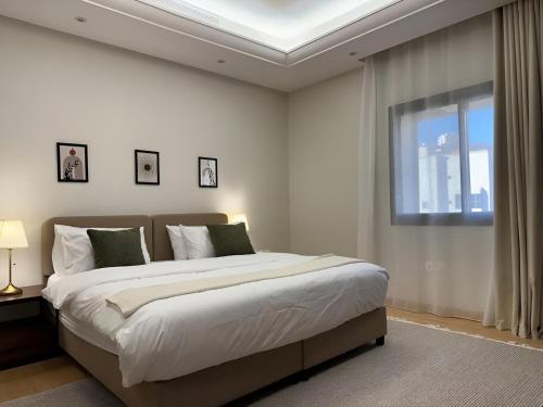 Z Residence by Dayf - Self-Service Apartmentsにあるベッド