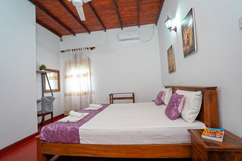 Ένα ή περισσότερα κρεβάτια σε δωμάτιο στο 4ty two Homestay Galle