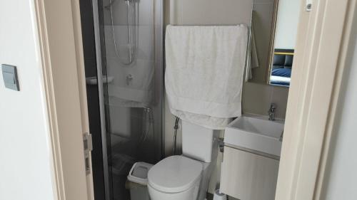 a bathroom with a shower and a toilet and a sink at Lumpini park chatuchak in Bangkok