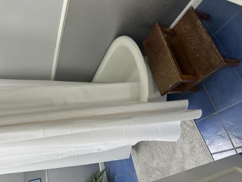 a bathroom with a toilet and a pile of paper at Classic Stowe Ski Chalet chalet in Stowe