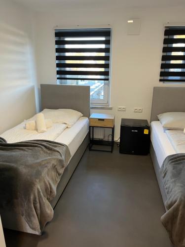 Ένα ή περισσότερα κρεβάτια σε δωμάτιο στο Sleep & Cook Augsburg