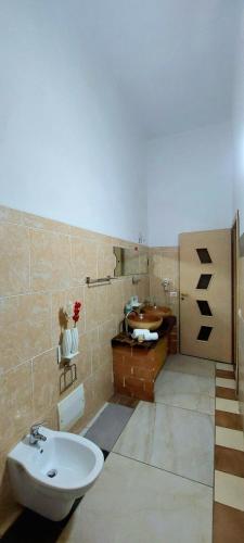 a bathroom with a sink and a toilet at B&B Cappotto civico 48 in Pompei
