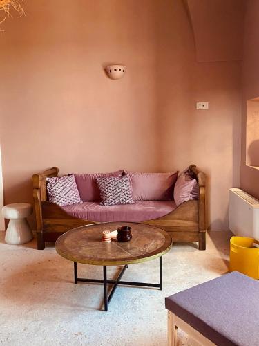 a living room with a couch and a coffee table at Antica Masseria le Monache in Grottaglie