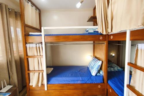 a couple of bunk beds in a room at Intoy's Place Panglao near Beach in Panglao