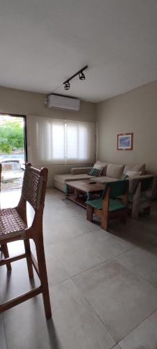 a living room with a couch and a table at Casa Bella vista in Paysandú