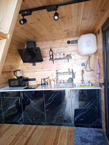 a kitchen in a tiny house at Redi house in Batumi