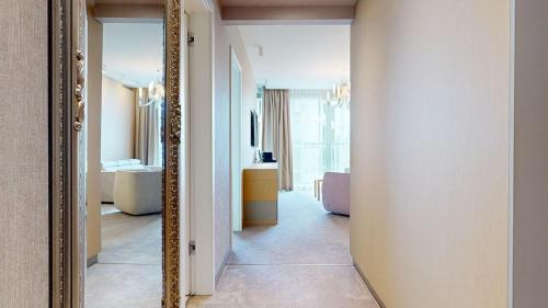 a mirror in a room with a bathroom at Eurovea Tower Apartments in Petržalka