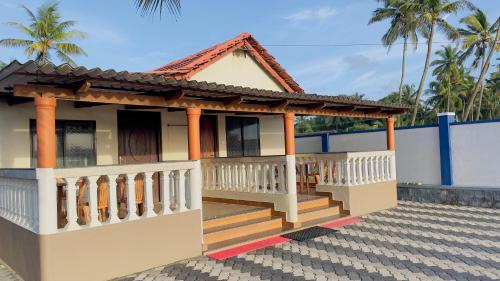 a model of a house with a balcony at Sea Shells by Malpe - Udupi in Cocoanut Island