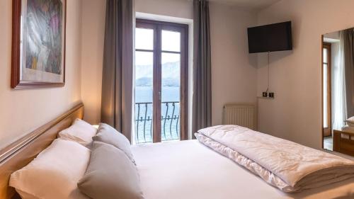 Postel nebo postele na pokoji v ubytování Hotel Lido