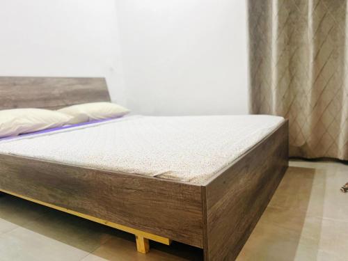 a bed sitting in a room with a mattress at Ksar Rimal par Immo Marina Vacances de Rêve MF in Marina Smir