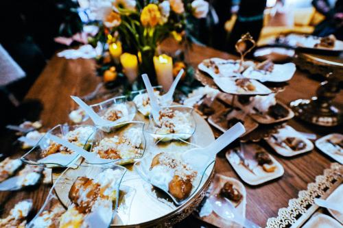 a table with plates of food on a table at Hotel Indigo Nashville - The Countrypolitan in Nashville