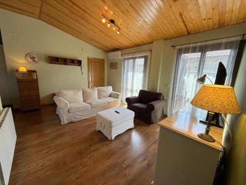 a living room with a couch and a table at APARTAMENTOS RioMonte 4 in Margudgued