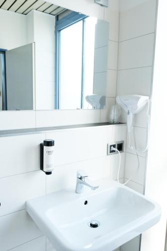 Ein Badezimmer in der Unterkunft Stargaze Forum Hotel Düsseldorf-Hilden