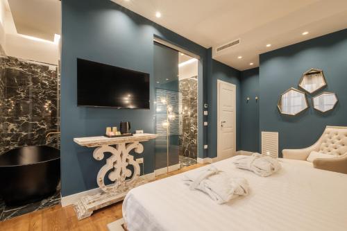 Katil atau katil-katil dalam bilik di Luxury Suites in the Heart of Cagliari