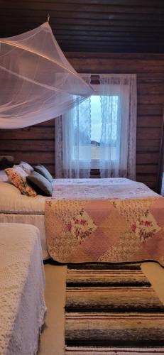 Postel nebo postele na pokoji v ubytování Villa Miilia maalaismajoitus ja spa