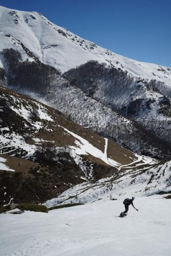 a person is skiing down a snow covered mountain at Vejtse House in Tetovo