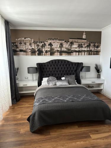 a bedroom with a large bed and two night stands at Guest House Imperial in Split
