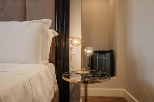 Katil atau katil-katil dalam bilik di Luxury Suites in the Heart of Cagliari