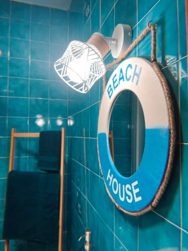a bathroom with a beach house sign on the wall at Blue Vibes, Relax & Beach in San Javier