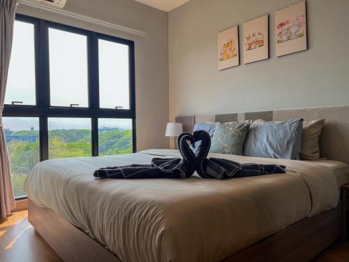 Ένα ή περισσότερα κρεβάτια σε δωμάτιο στο The Astra Sky River Condo Chiang Mai