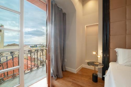 Katil atau katil-katil dalam bilik di Luxury Suites in the Heart of Cagliari
