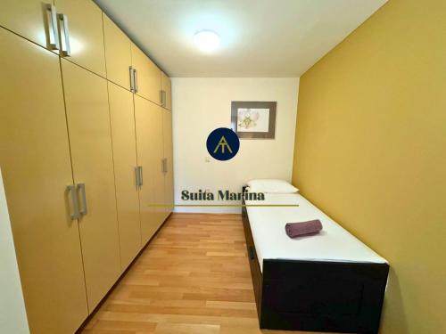 a hospital room with a bed and a corridor at SUITA MARINA - Near Beach with Terrace & 2 Parking Spaces at Marina Portoroz in Portorož
