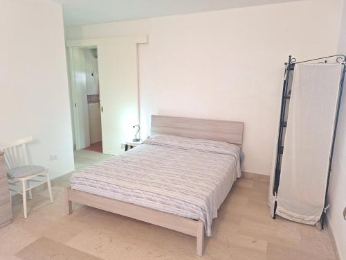 a bedroom with a bed and a ladder in it at Masseria Li Camerini in Vanze
