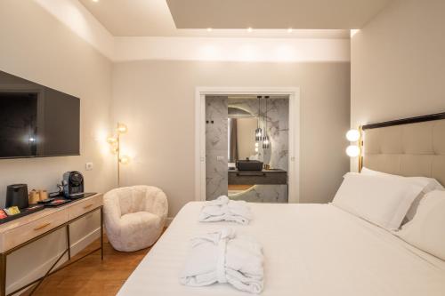 Katil atau katil-katil dalam bilik di Luxury Suites in the Heart of Cagliari