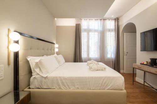 Katil atau katil-katil dalam bilik di Luxury Suites in the Heart of Cagliari